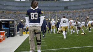 Notre Dame wide receiver on the sideline in street clothes before the Wisconsin season opener