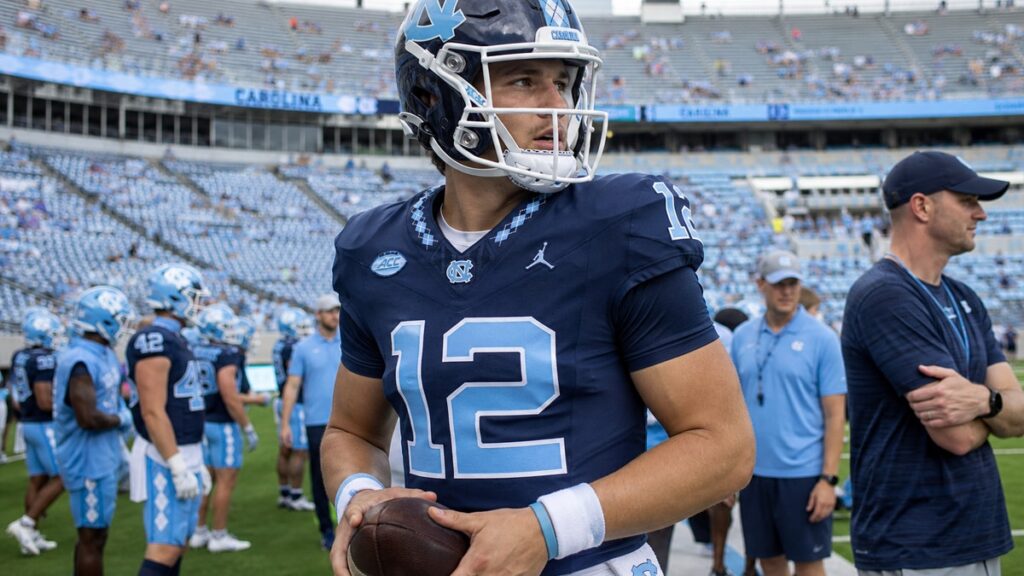 North Carolina quarterback on the sideline preparing for the season opener against TCU