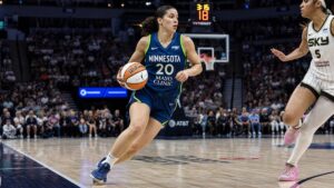 Olivia Miles driving to the basket for the Minnesota Lynx against the Golden State Valkyries