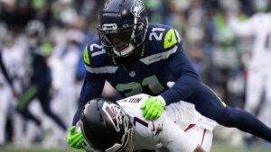 Devon Witherspoon making a tackle for the Seattle Seahawks