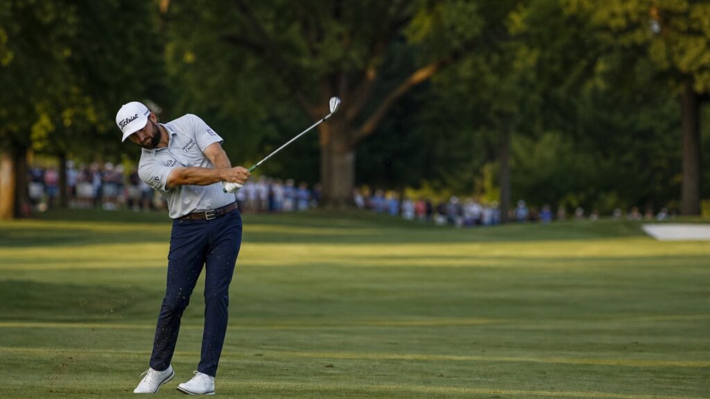 Cameron Young hitting an approach shot at Sedgefield Country Club during the Wyndham Championship