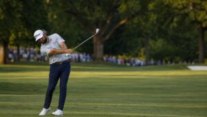 Cameron Young hitting an approach shot at Sedgefield Country Club during the Wyndham Championship