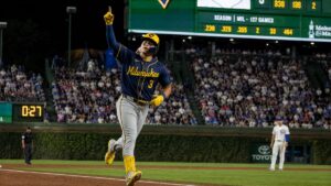 Joey Ortiz celebrating a home run for the Milwaukee Brewers at Wrigley Field