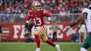 Brock Purdy scrambling for the San Francisco 49ers against the Los Angeles Rams