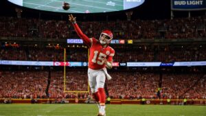 Patrick Mahomes throwing a pass for the Kansas City Chiefs at Arrowhead Stadium