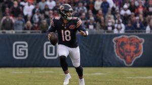 Caleb Williams scrambling for the Chicago Bears before his hamstring injury