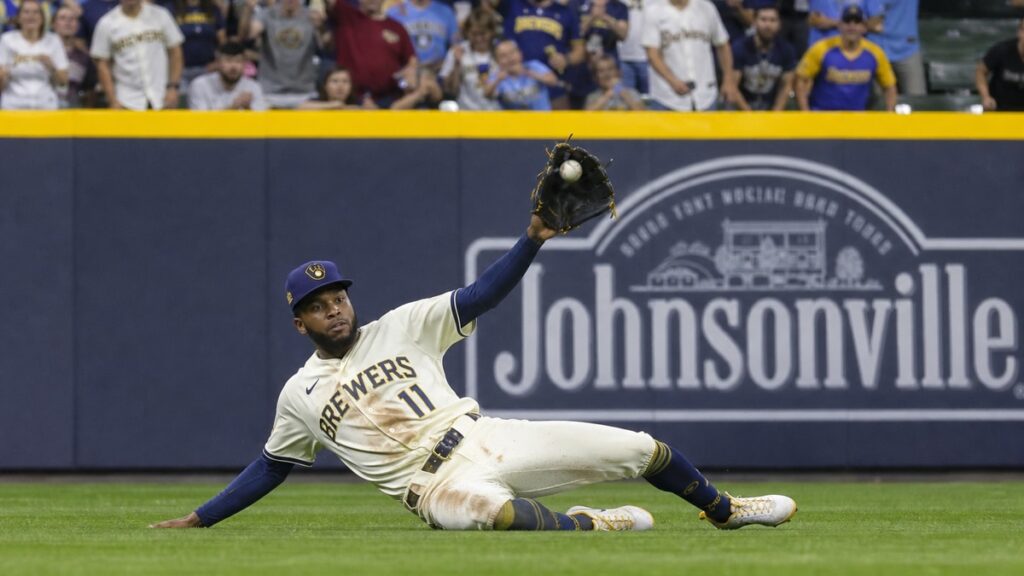 Jackson Chourio making a sliding catch for the Milwaukee Brewers