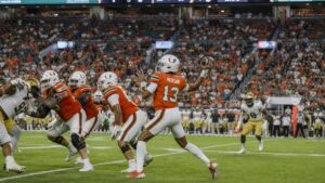 Darian Mensah throwing a pass for the Miami Hurricanes