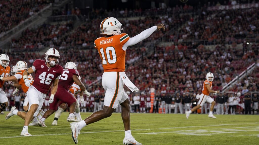 Miami Hurricanes quarterback Darian Mensah throwing a pass during his debut against Stanford
