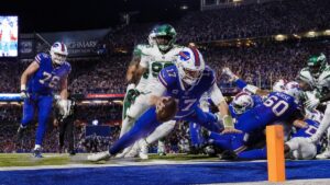 Josh Allen scoring a touchdown for the Buffalo Bills against the Detroit Lions