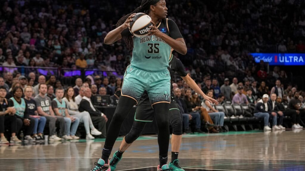 Jonquel Jones grabbing a rebound for the New York Liberty against the Minnesota Lynx