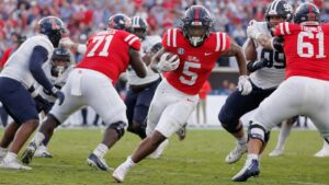Kewan Lacy running the ball for the Ole Miss Rebels