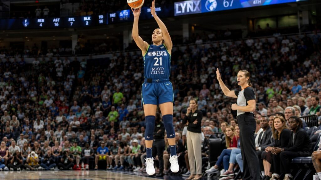 Kayla McBride shooting a three-pointer for the Minnesota Lynx at Target Center