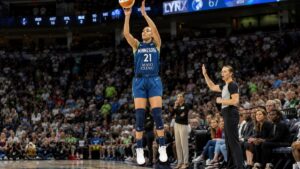 Kayla McBride shooting a three-pointer for the Minnesota Lynx at Target Center