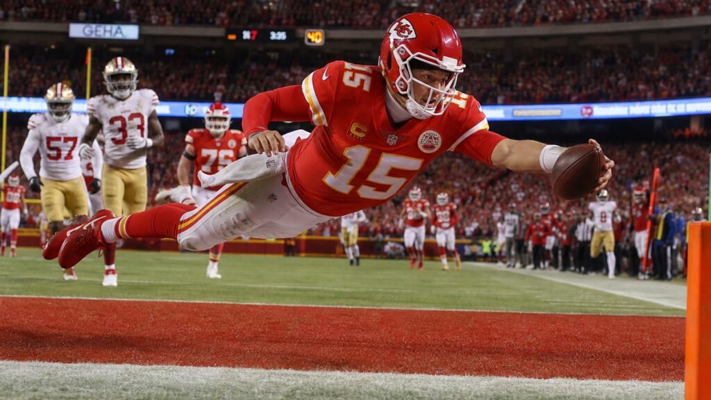 Patrick Mahomes running the ball for the Kansas City Chiefs against the Denver Broncos