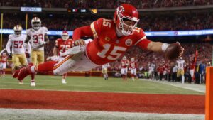 Patrick Mahomes running the ball for the Kansas City Chiefs against the Denver Broncos