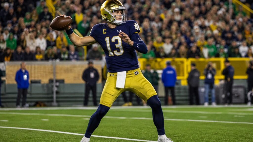 CJ Carr throwing a pass for Notre Dame against Wisconsin at Lambeau Field