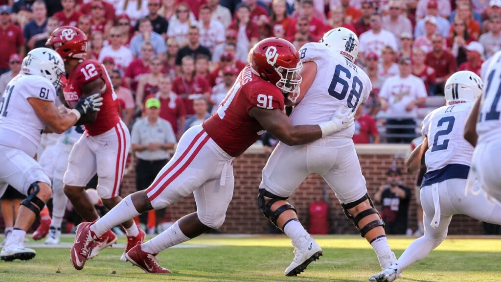 Oklahoma defensive tackle in action during a college football game, representing David Stone injury news ahead of Georgia matchup