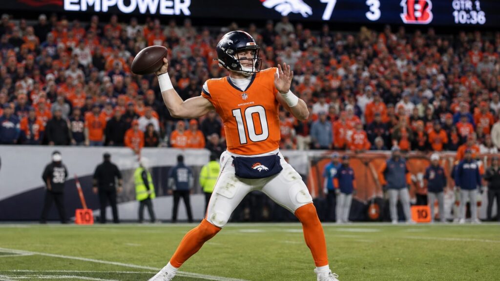 Bo Nix throwing a pass for the Denver Broncos at Empower Field at Mile High