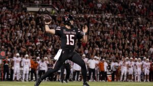 Texas Tech Red Raiders quarterback Will Hammond throwing a pass against Houston in Big 12 action