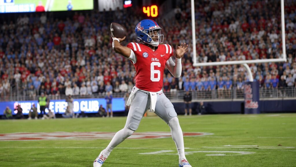 Trinidad Chambliss throwing a pass for the Ole Miss Rebels