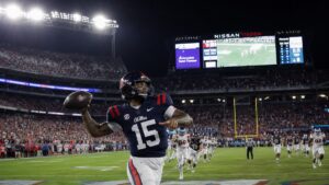Trinidad Chambliss throwing a pass for Ole Miss during the Music City Kickoff win over Louisville