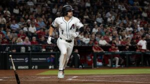 Corbin Carroll running to first base for the Arizona Diamondbacks at Chase Field