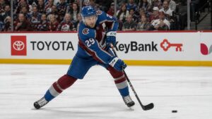 Nathan MacKinnon shooting the puck for the Colorado Avalanche against the Winnipeg Jets