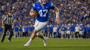BYU quarterback Bear Bachmeier scrambling at LaVell Edwards Stadium in a Cougars uniform