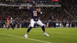 Caleb Williams of the Chicago Bears dropping back to pass at Soldier Field