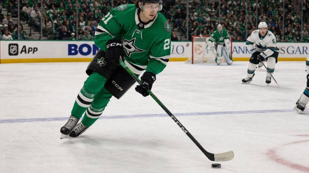 Jason Robertson of the Dallas Stars skating with the puck during a home game