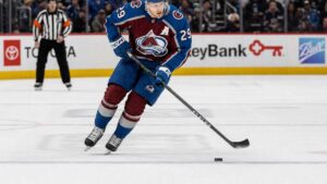 Nathan MacKinnon of the Colorado Avalanche skating with the puck against the Philadelphia Flyers