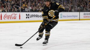 David Pastrnak of the Boston Bruins skating with the puck at TD Garden