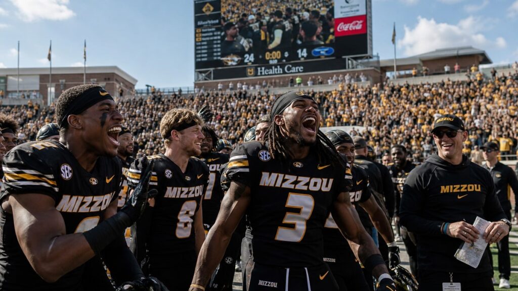 Missouri Tigers players celebrating on the sideline at Faurot Field during their 2026 season