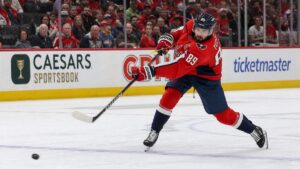 Alex Tuch of the Washington Capitals shooting the puck toward the net against the Seattle Kraken