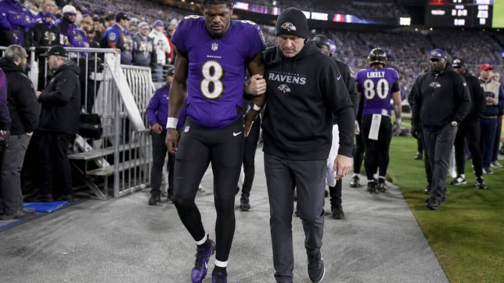 Lamar Jackson on the Baltimore Ravens sideline dealing with an ankle injury ahead of Sunday Night Football against the Falcons