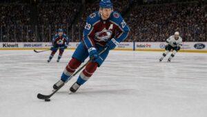 Nathan MacKinnon skating with the puck for the Colorado Avalanche at Ball Arena