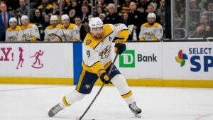 Filip Forsberg of the Nashville Predators skating with the puck in an NHL game