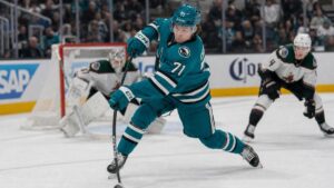 Macklin Celebrini of the San Jose Sharks driving to the net to take a shot