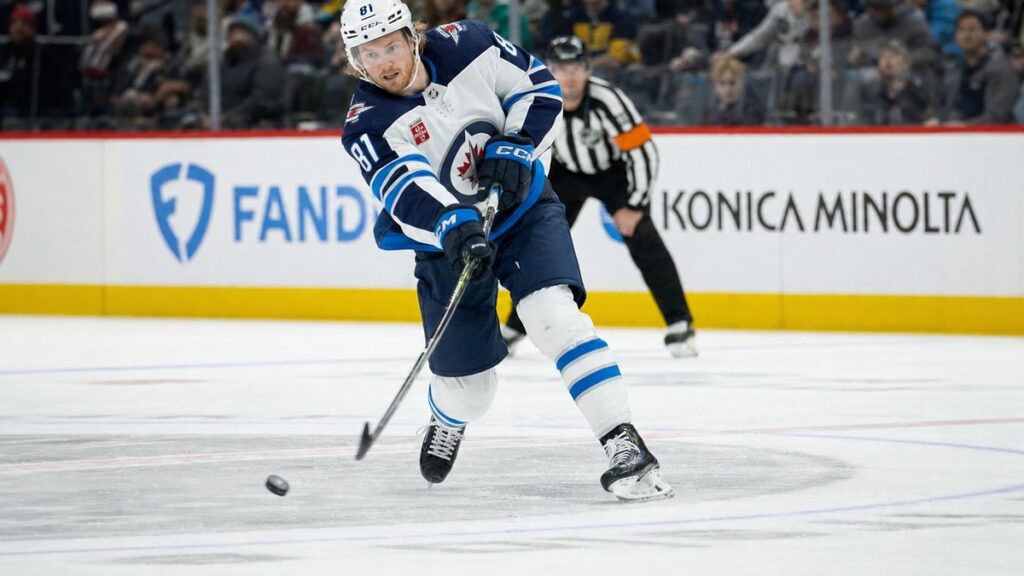 Kyle Connor of the Winnipeg Jets taking a shot on goal in an NHL game