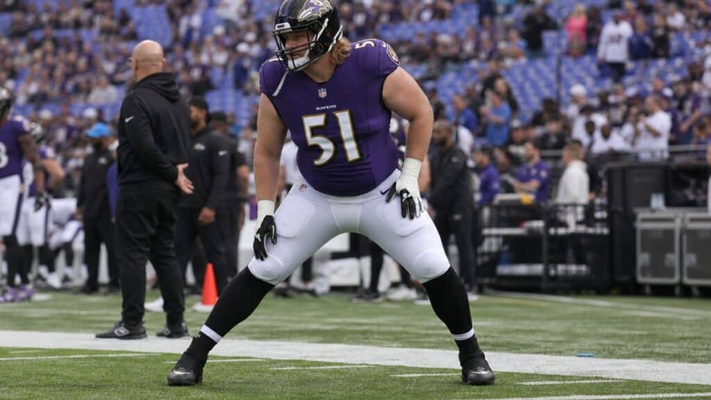 Cam Jurgens in Baltimore Ravens uniform during pre-game warmups