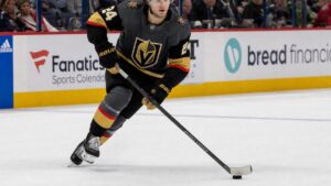 Trevor Connelly skating with the puck for the Vegas Golden Knights in an NHL game